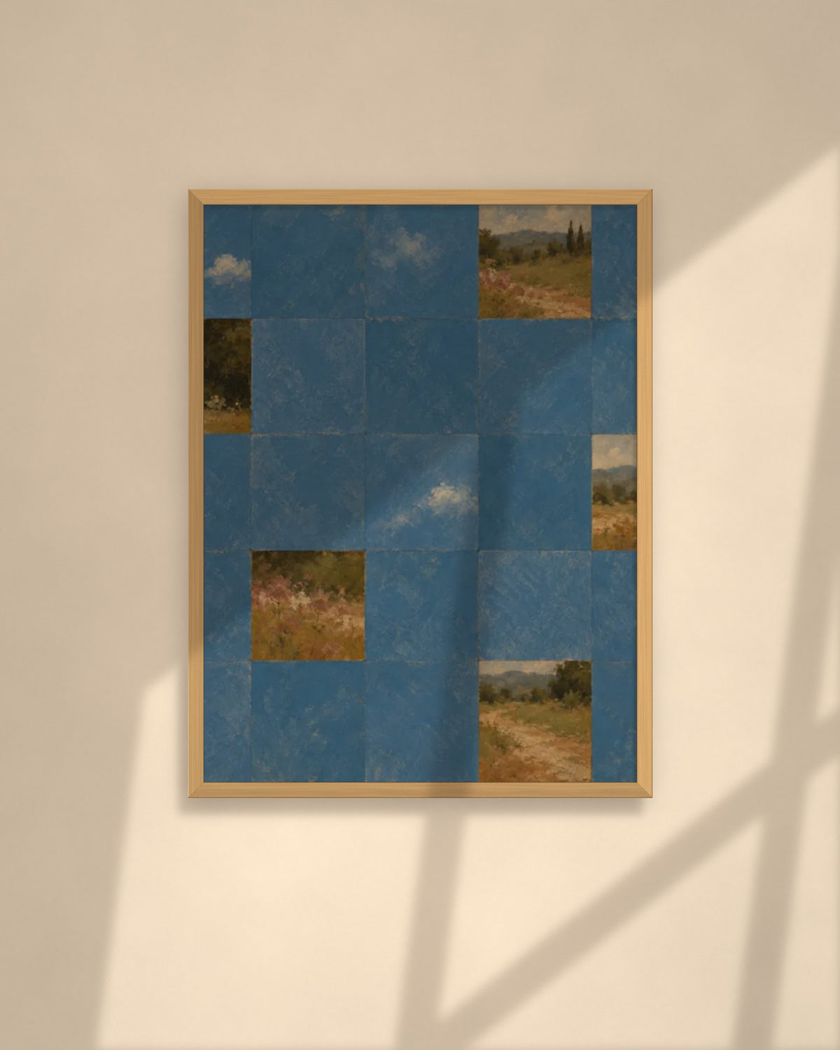 Blue Garden Tiles art print in a natural oak frame above a cream sofa in a sunlit living room