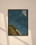 Blue Horizon art print in a black frame on a warm beige wall with sunlight and window shadows