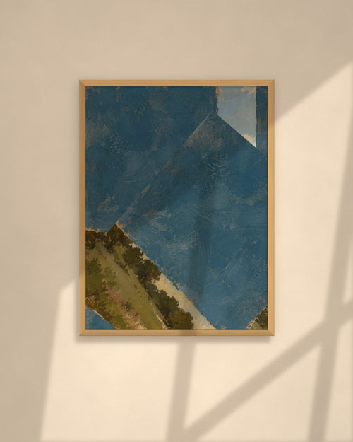 Blue Horizon art print in a natural oak frame above a cream sofa in a sunlit living room