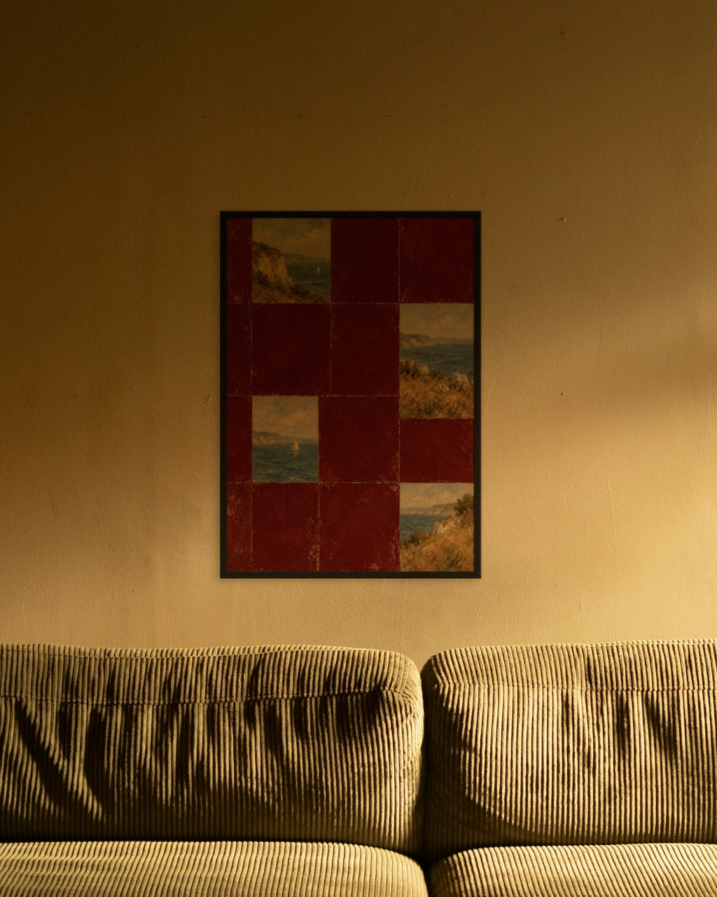 Burgundy Coast Tiles art print in a black frame above an olive corduroy sofa lit by a warm lamp