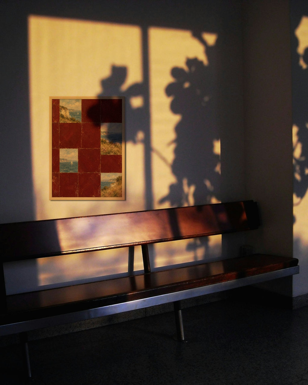 Burgundy Coast Tiles art print in a natural oak frame on a sunlit wall with plant shadows above a wooden bench
