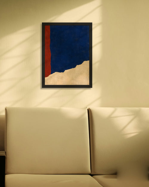 Cobalt Ridge art print in a black frame on a cream wall with window shadows above a sofa