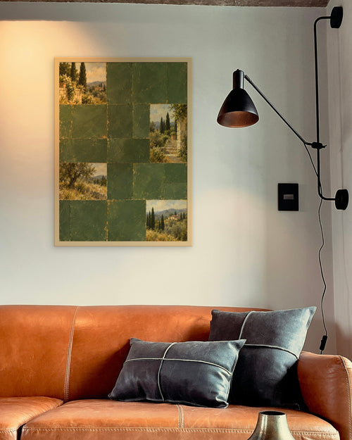 Cypress Hill Tiles art print in a natural oak frame above a cognac leather sofa beside a black wall lamp