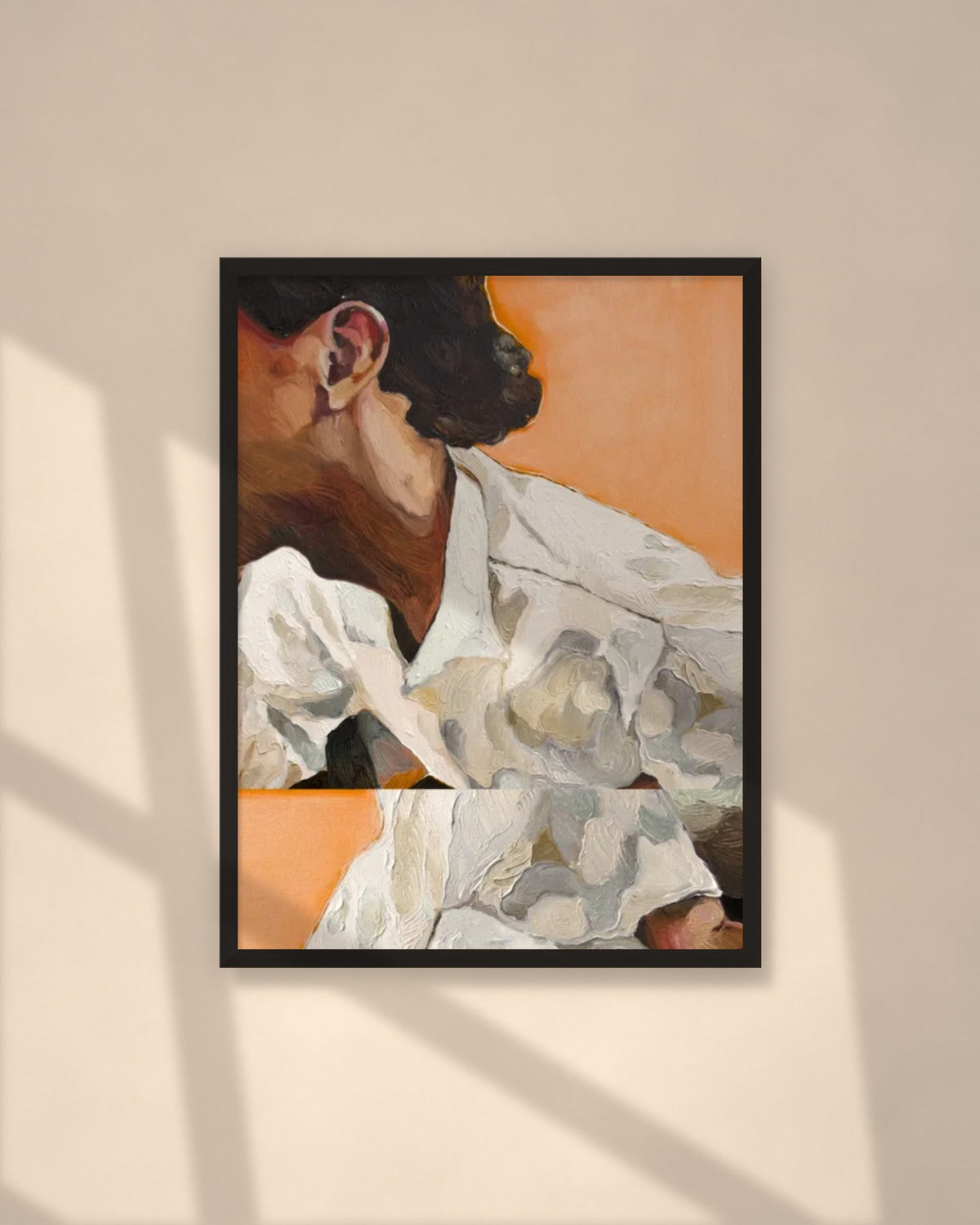 Linen in Apricot art print in a black frame on a warm beige wall with sunlight and window shadows