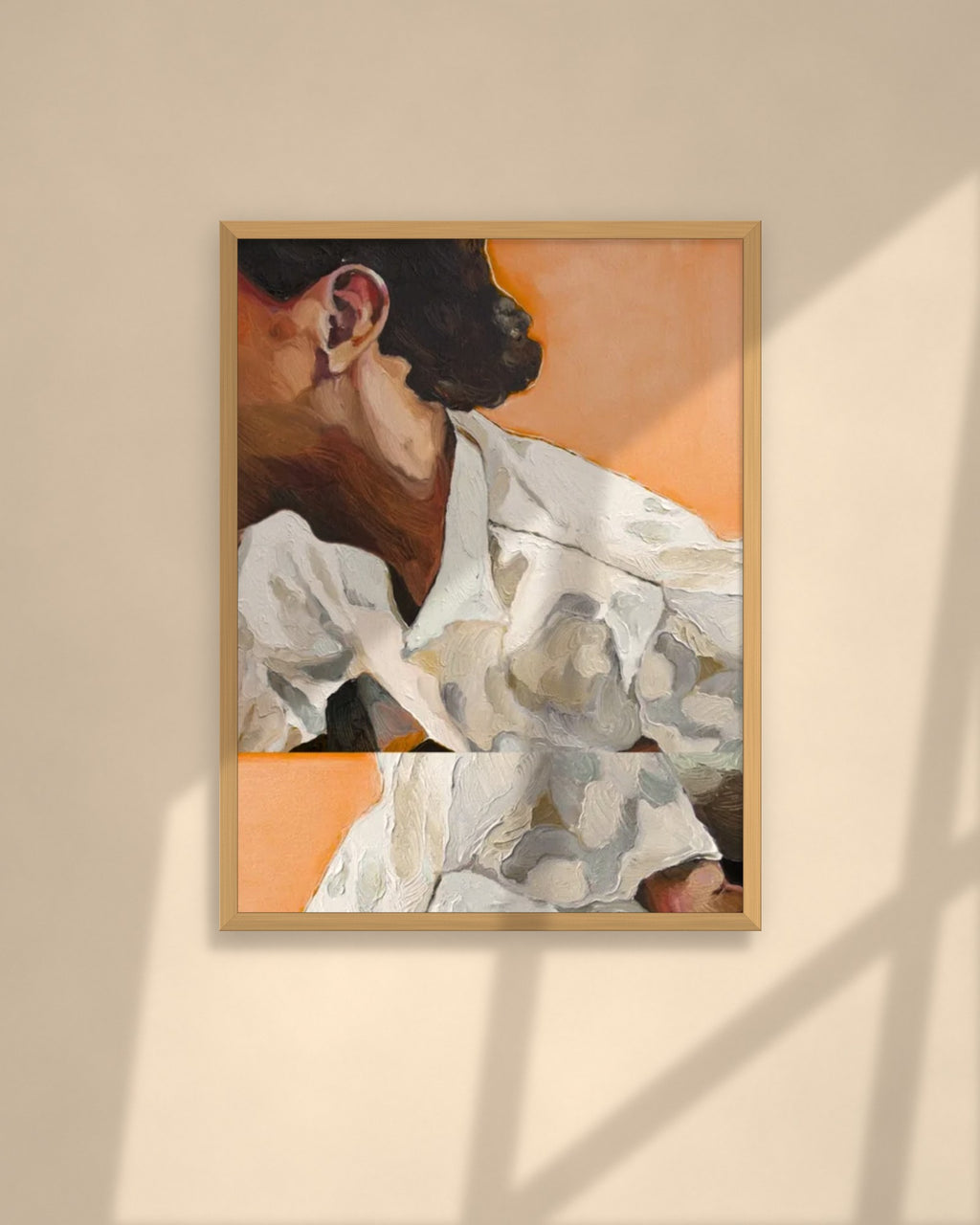 Linen in Apricot art print in a natural oak frame above a cream sofa in a sunlit living room