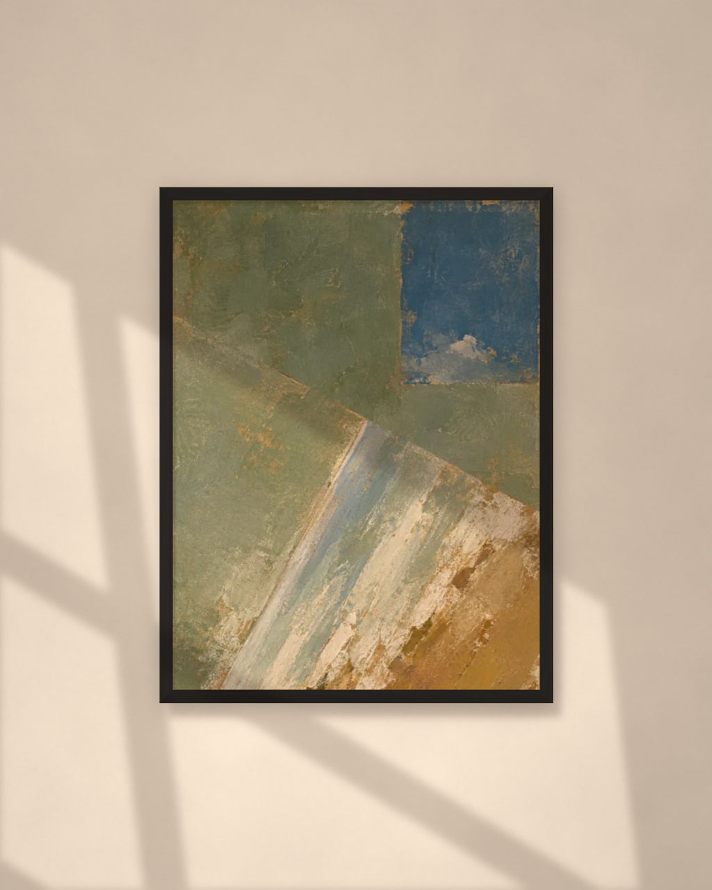 Olive & Ochre art print in a black frame on a warm beige wall with sunlight and window shadows