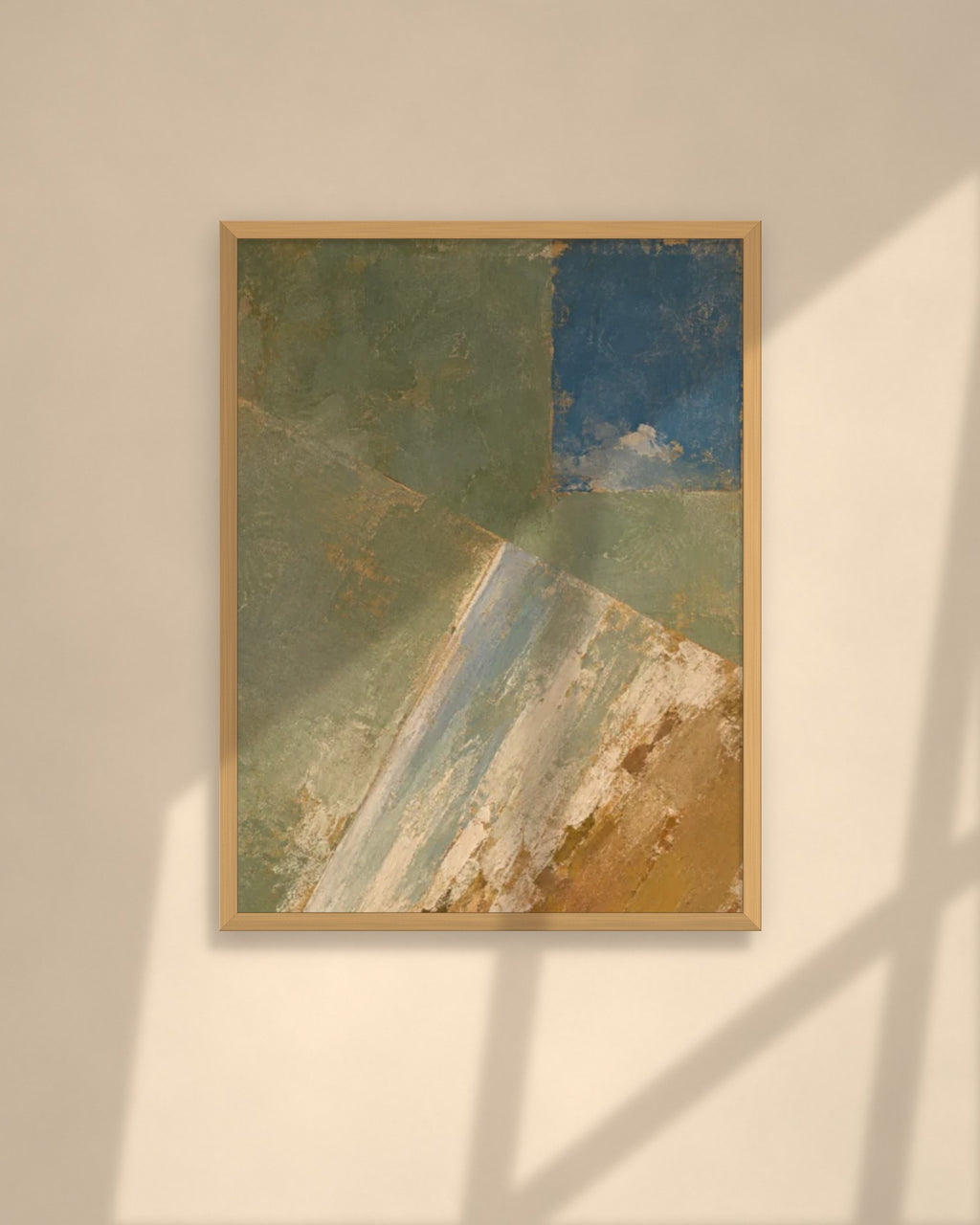 Olive & Ochre art print in a natural oak frame above a cream sofa in a sunlit living room
