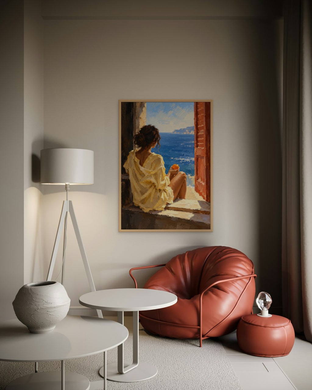 Orange by the Sea art print in a natural oak frame above a terracotta leather lounge chair in a softly lit corner