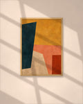 Saffron Composition art print in a natural oak frame above a wooden desk in a bright Scandinavian study