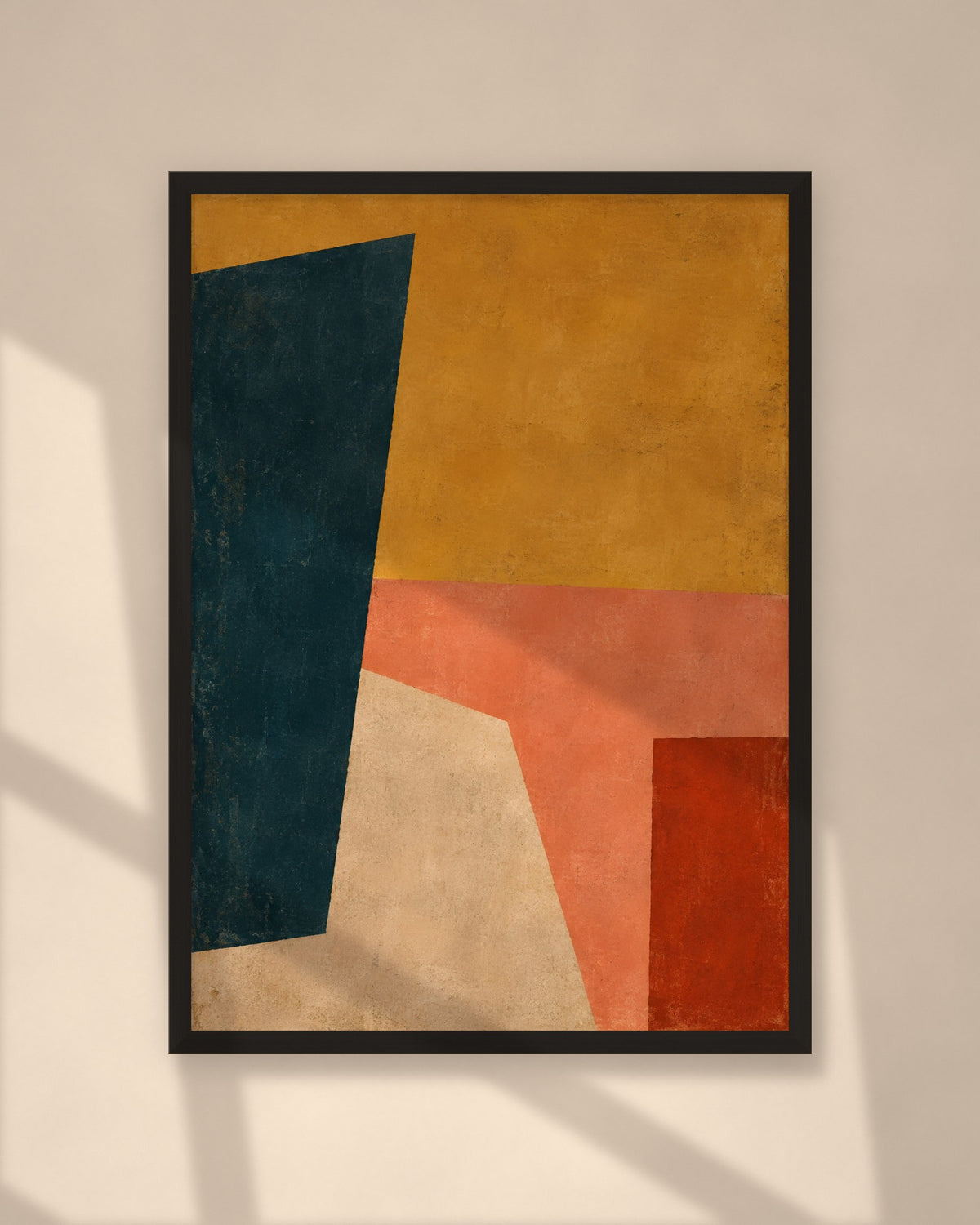 Saffron Composition art print in a black frame on a warm beige wall with sunlight and window shadows
