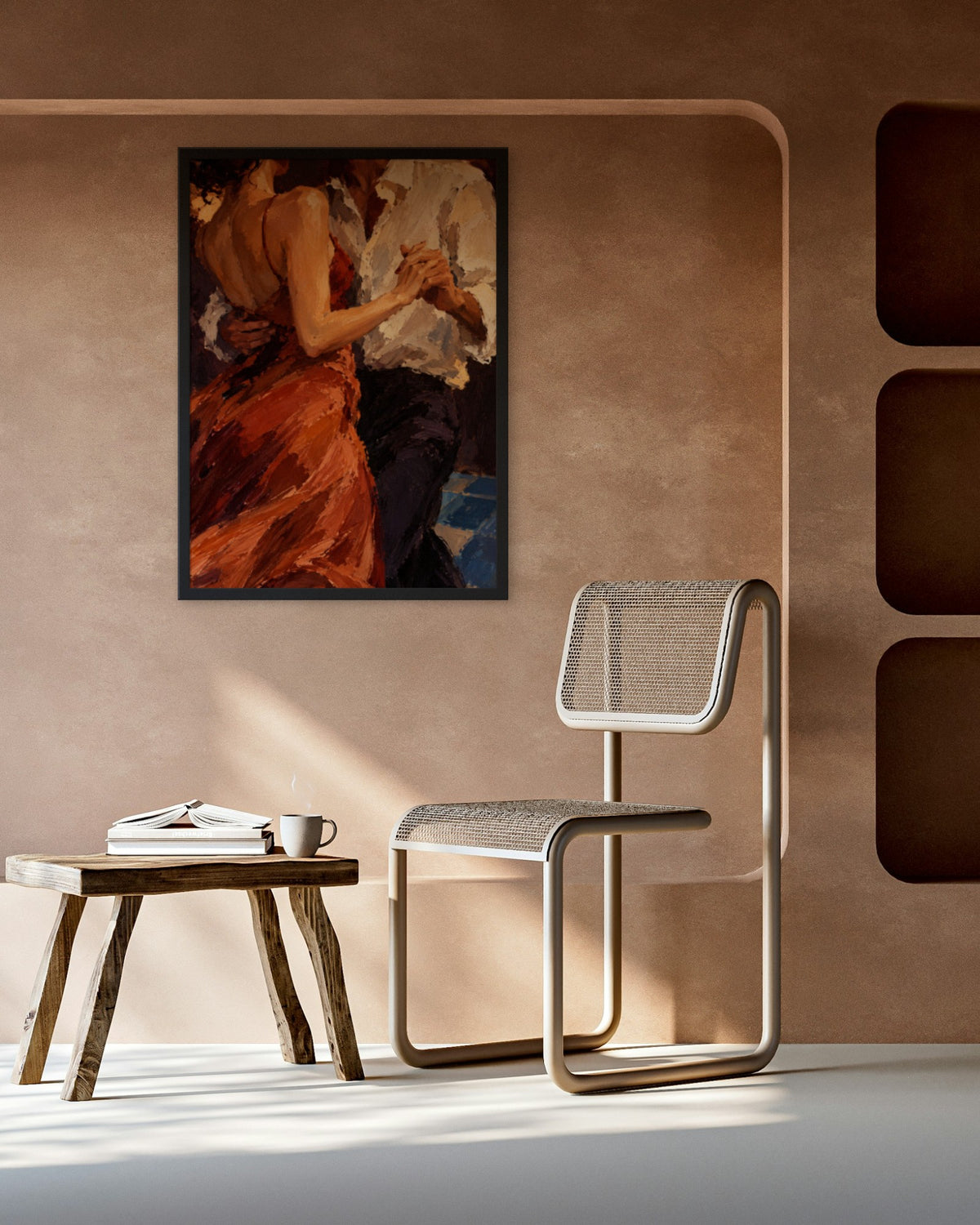 Slow Dance art print in a black frame on a terracotta plaster wall above a cane chair