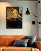 Slow Morning art print in a black frame above a cognac leather sofa beside a black wall lamp