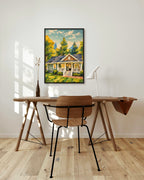 Summer Cottage art print in a black frame above a wooden desk in a bright Scandinavian study