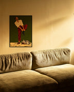 Sunday Socks art print in a black frame above an olive corduroy sofa in warm evening light