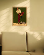 Sunday Socks art print in a natural oak frame on a cream wall with window shadows above a sofa