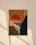 Sunset Cliffs art print in a natural oak frame on a warm plaster wall