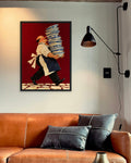 Tall Order art print in a black frame above a cognac leather sofa beside a black wall lamp