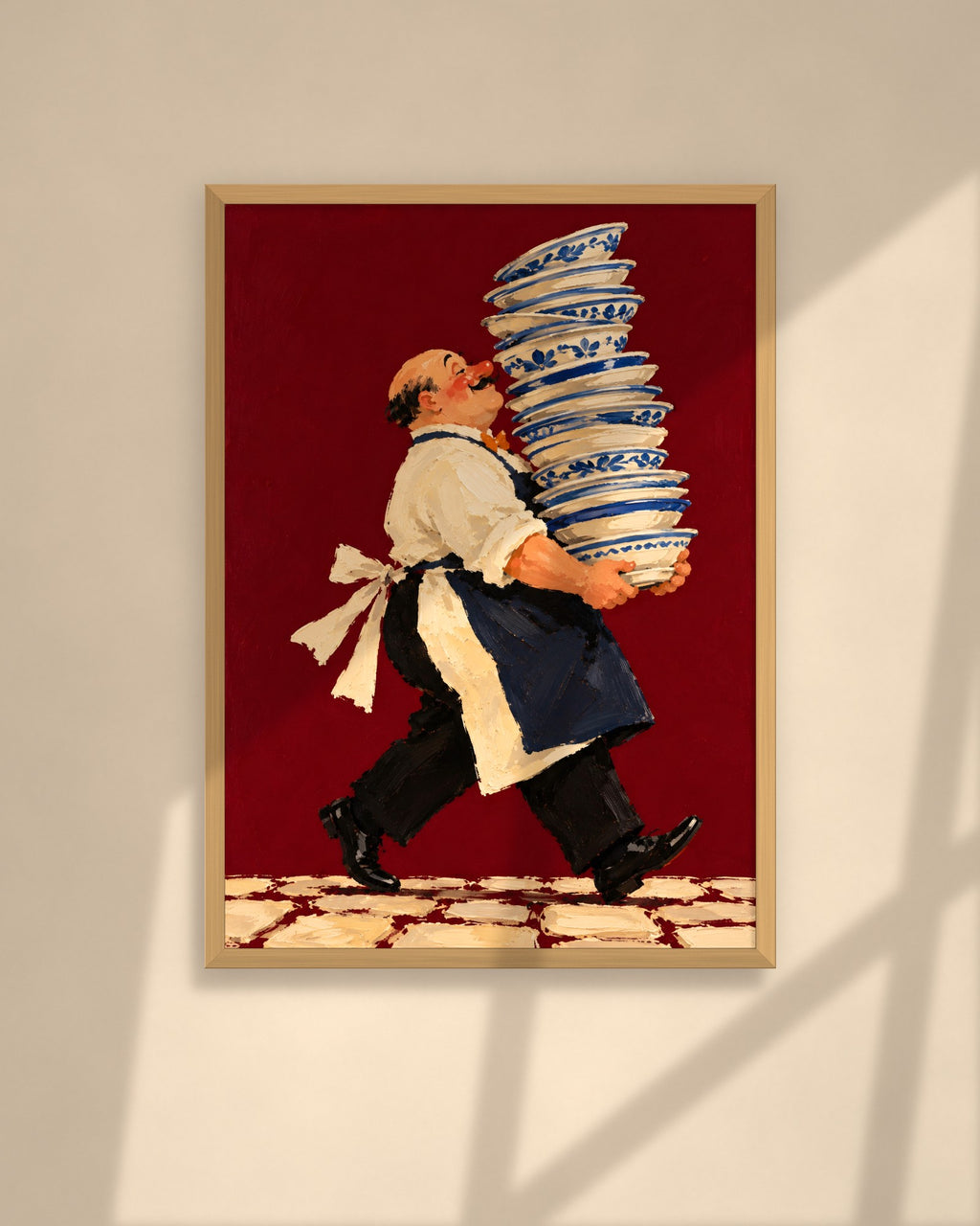 Tall Order art print in a walnut frame above a brown leather Chesterfield armchair