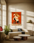 The Baguette Run art print in a natural oak frame above a cream curved sofa in a sunlit living room