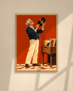 The Record Collector art print in a walnut frame above a brown leather Chesterfield armchair
