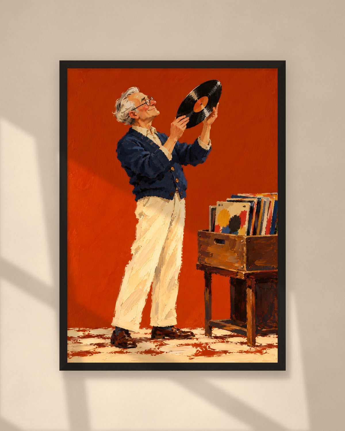 The Record Collector art print in a black frame on a warm beige wall with sunlight and window shadows
