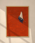 Vermilion Sail art print in a natural oak frame on a warm plaster wall
